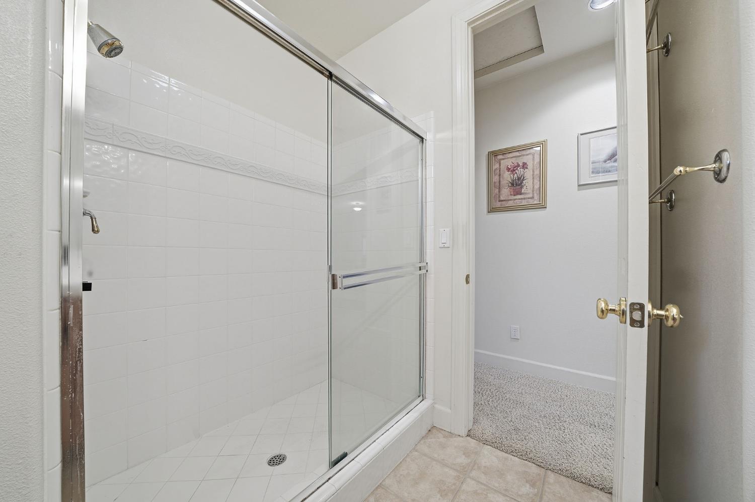 719 Shakeley Lane Ione, CA 95640 - Photo 52 of 68 a bathroom with a glass shower door