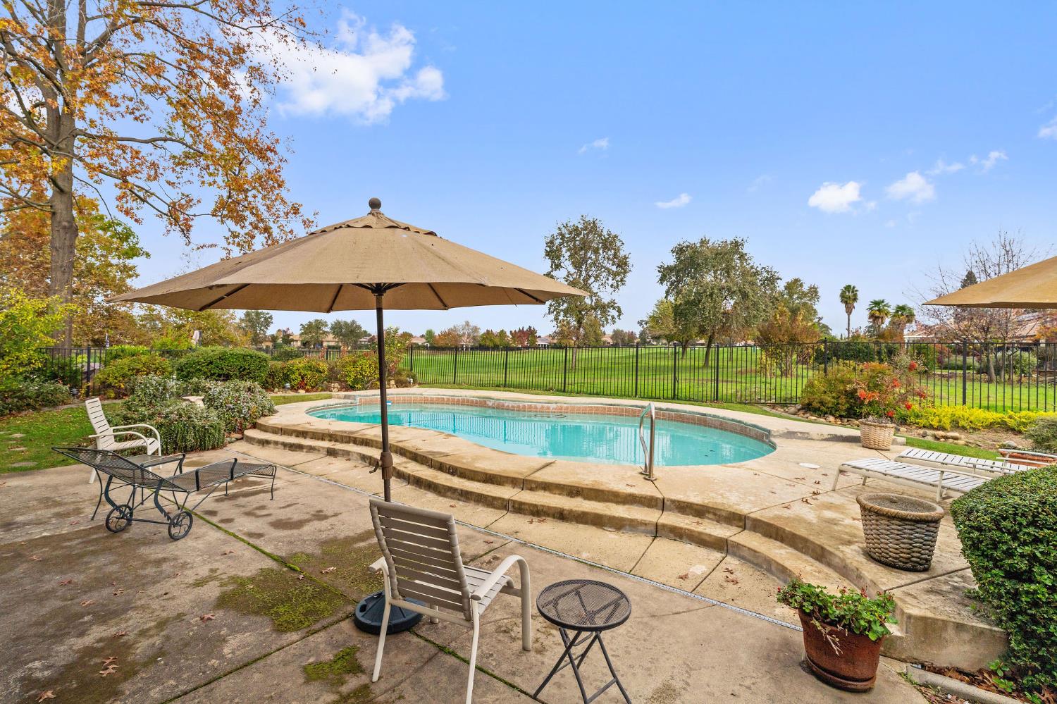 719 Shakeley Lane Ione, CA 95640 - Photo 59 of 68 a view of a backyard with swimming pool and sitting area