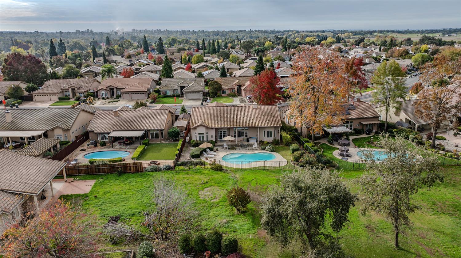 719 Shakeley Lane Ione, CA 95640 - Photo 64 of 68 an aerial view of a house with a garden and lake view
