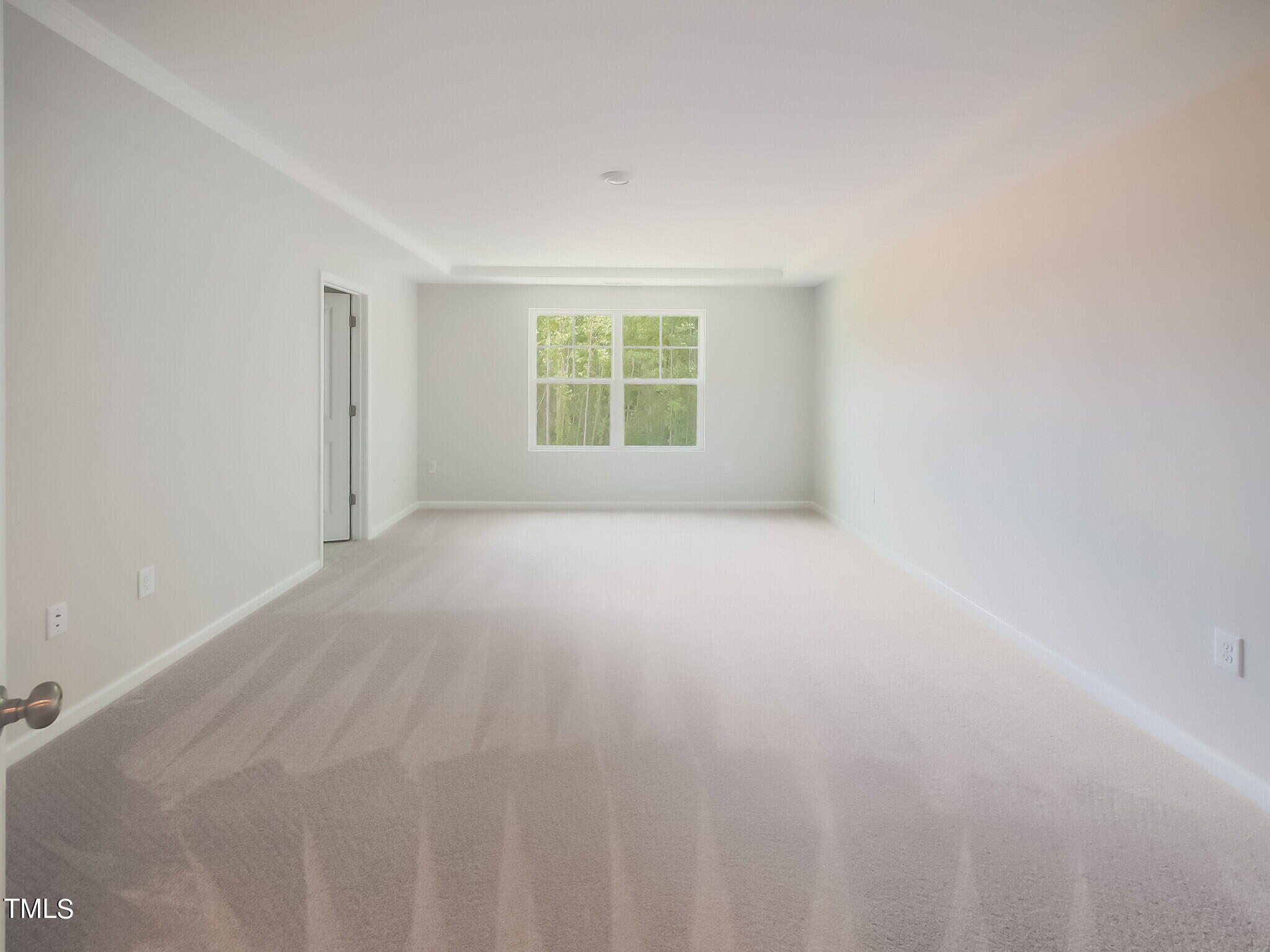 219 Aster Bloom Lane, Unit 394 Raleigh, NC 27610 - Photo 16 of 26 a view of an empty room with a window