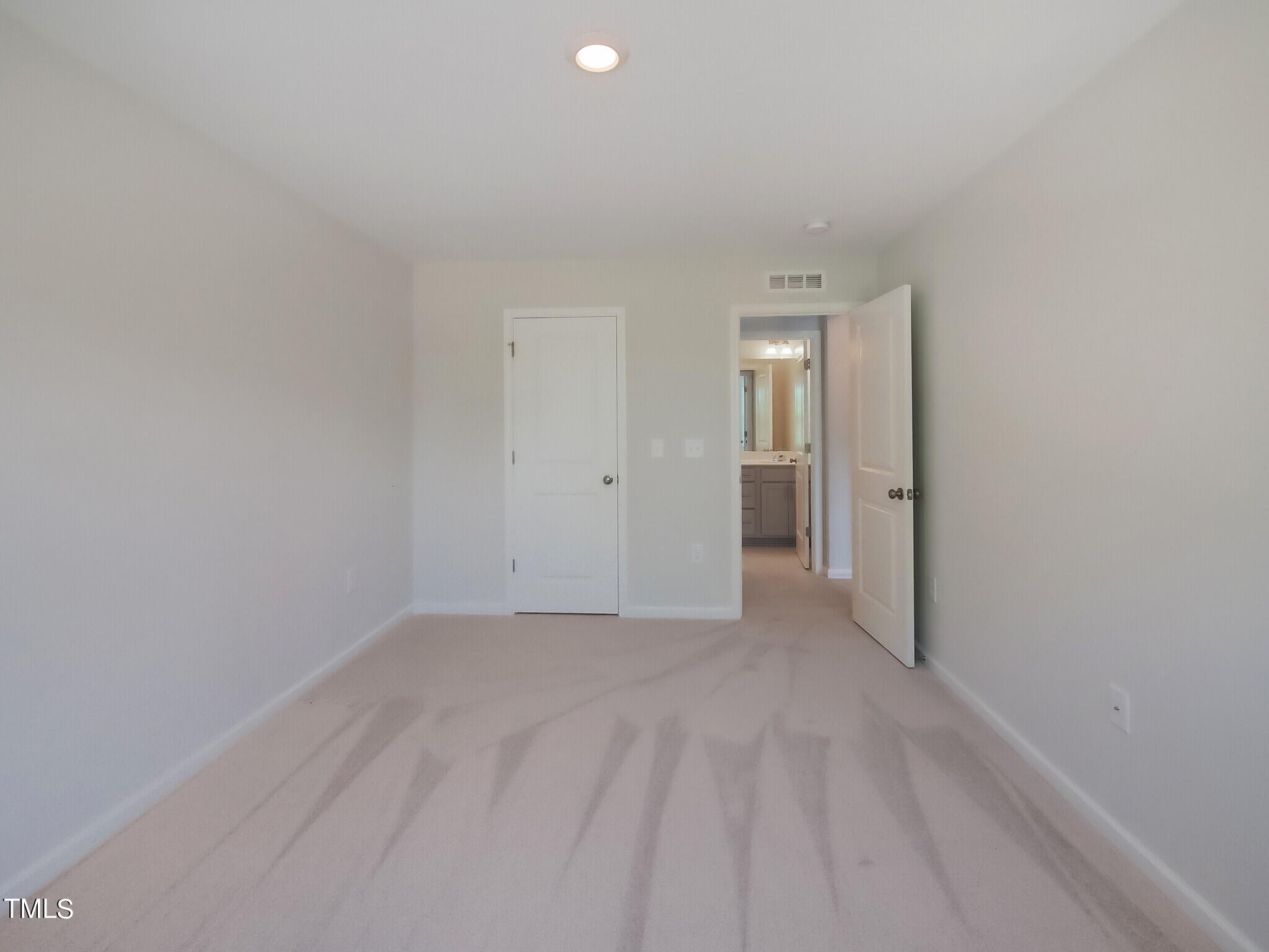 219 Aster Bloom Lane, Unit 394 Raleigh, NC 27610 - Photo 24 of 26 a view of an empty room
