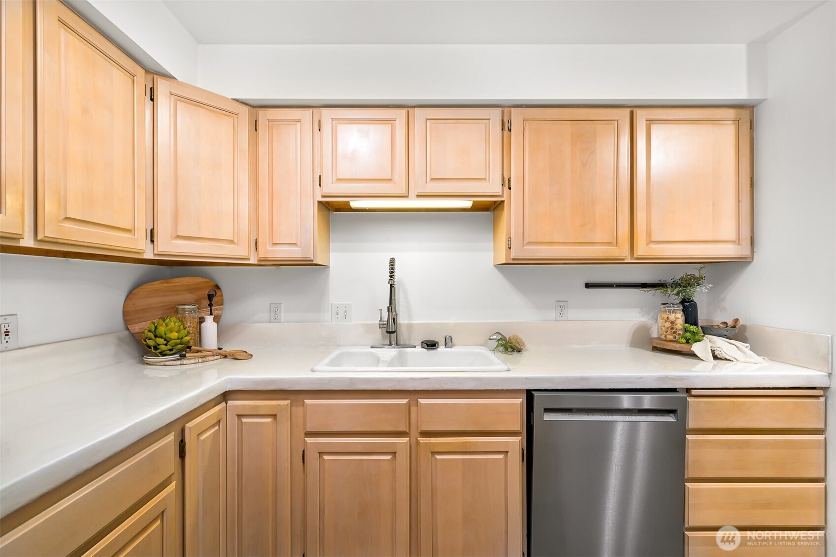 705 North State Street, Unit 202 Bellingham, WA 98225 - Photo 11 of 26 a kitchen with stainless steel appliances granite countertop a sink a stove cabinets and a window