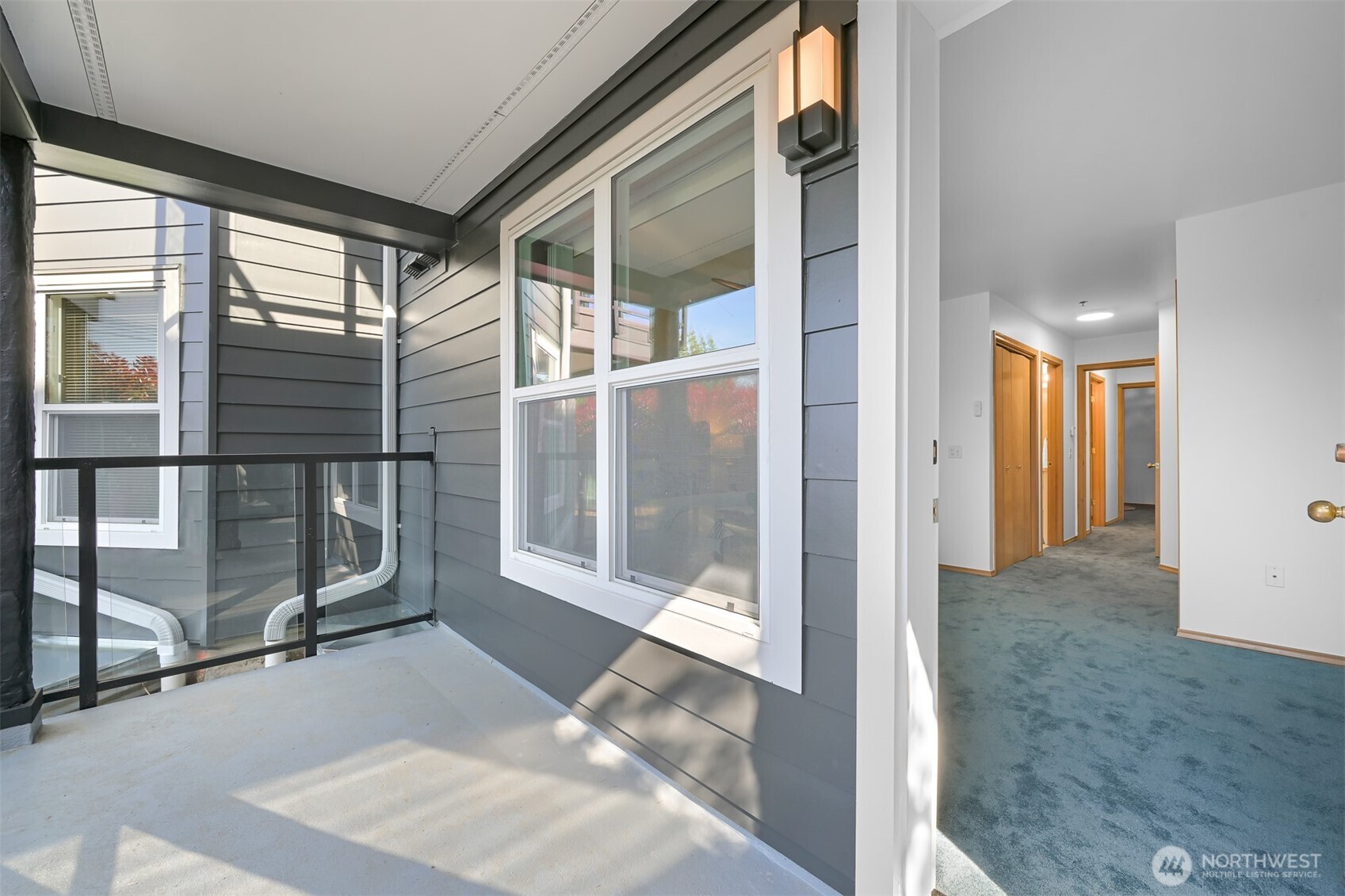 705 North State Street, Unit 202 Bellingham, WA 98225 - Photo 17 of 26 a view of a room with wooden floor and windows