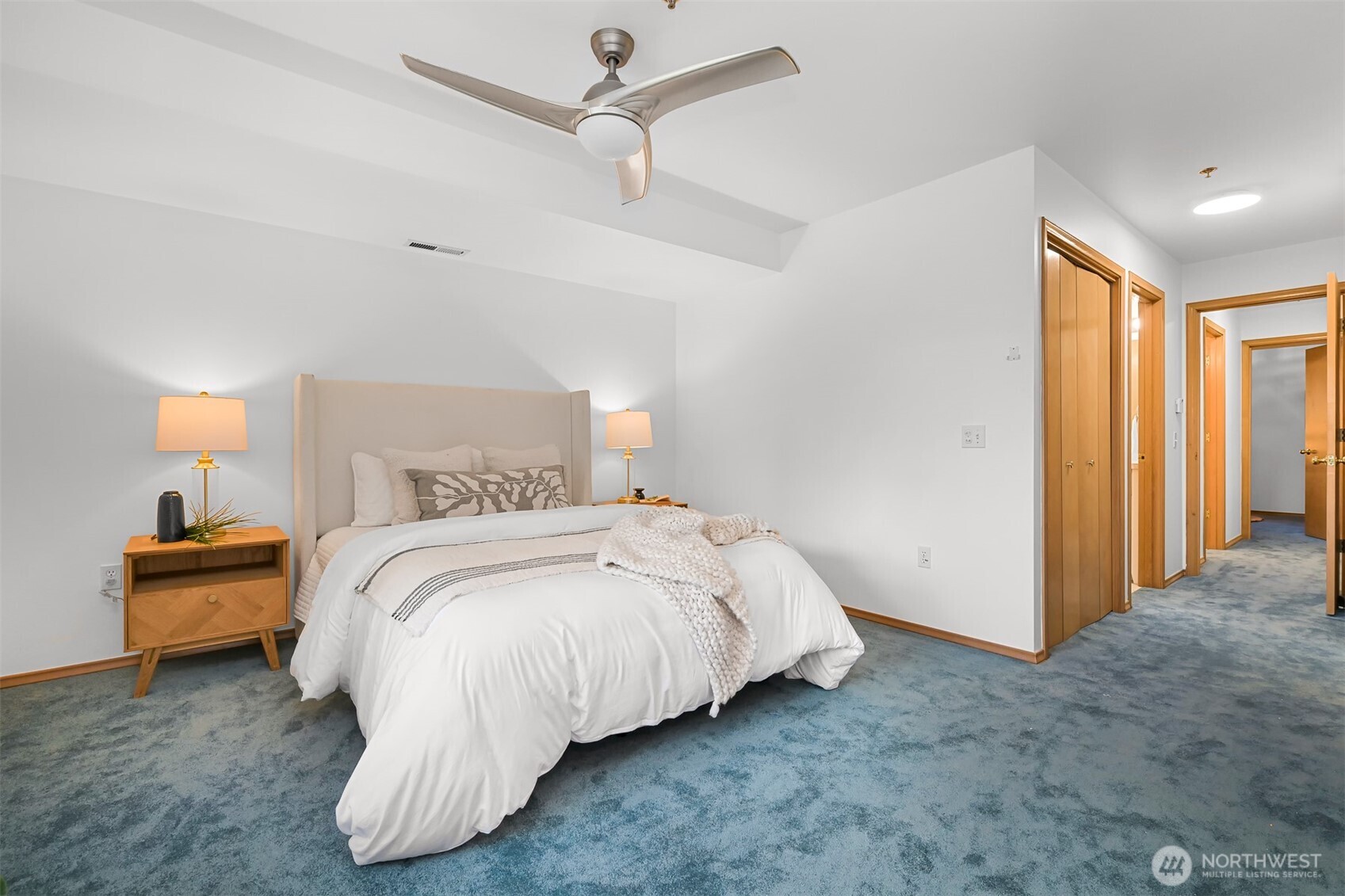 705 North State Street, Unit 202 Bellingham, WA 98225 - Photo 18 of 26 a bedroom with a bed and a lamp
