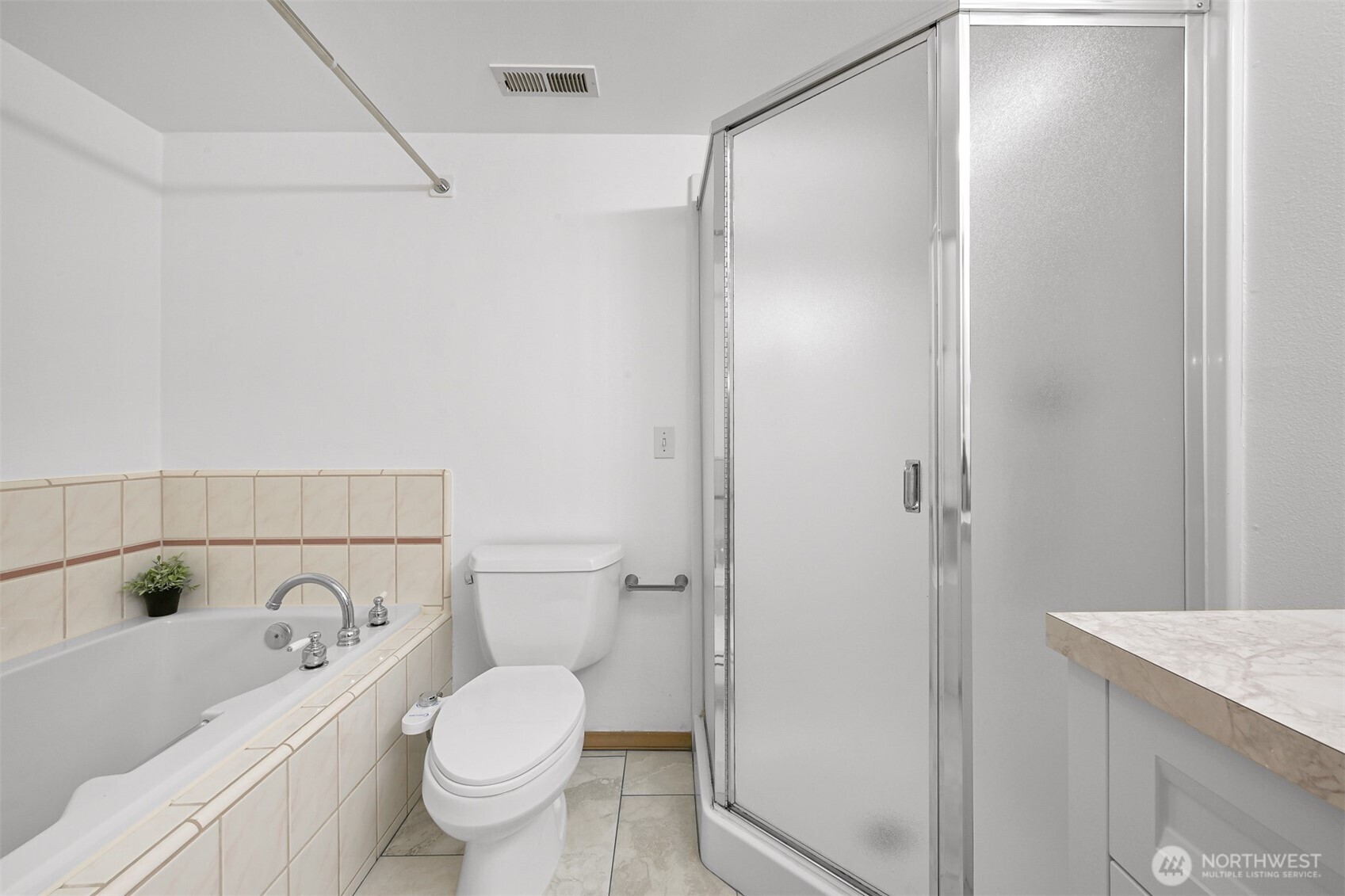 705 North State Street, Unit 202 Bellingham, WA 98225 - Photo 19 of 26 a bathroom with a granite countertop toilet and a sink