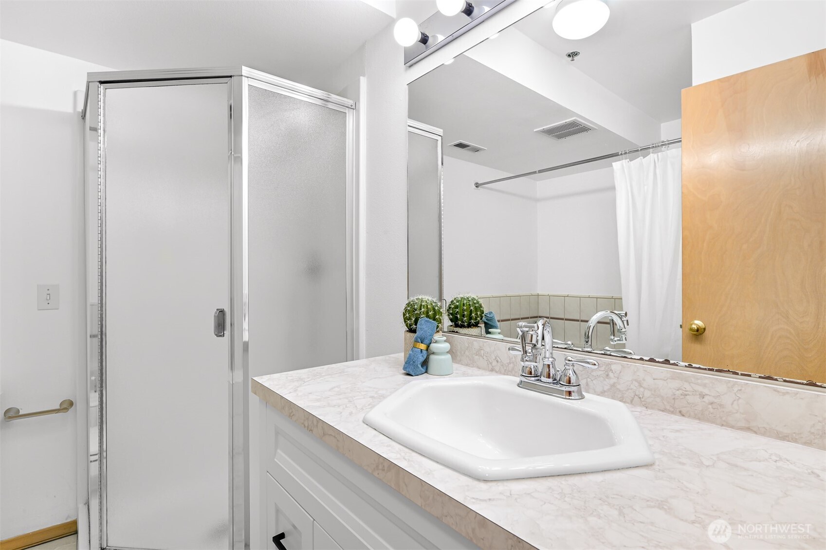 705 North State Street, Unit 202 Bellingham, WA 98225 - Photo 20 of 26 a bathroom with a sink and a mirror
