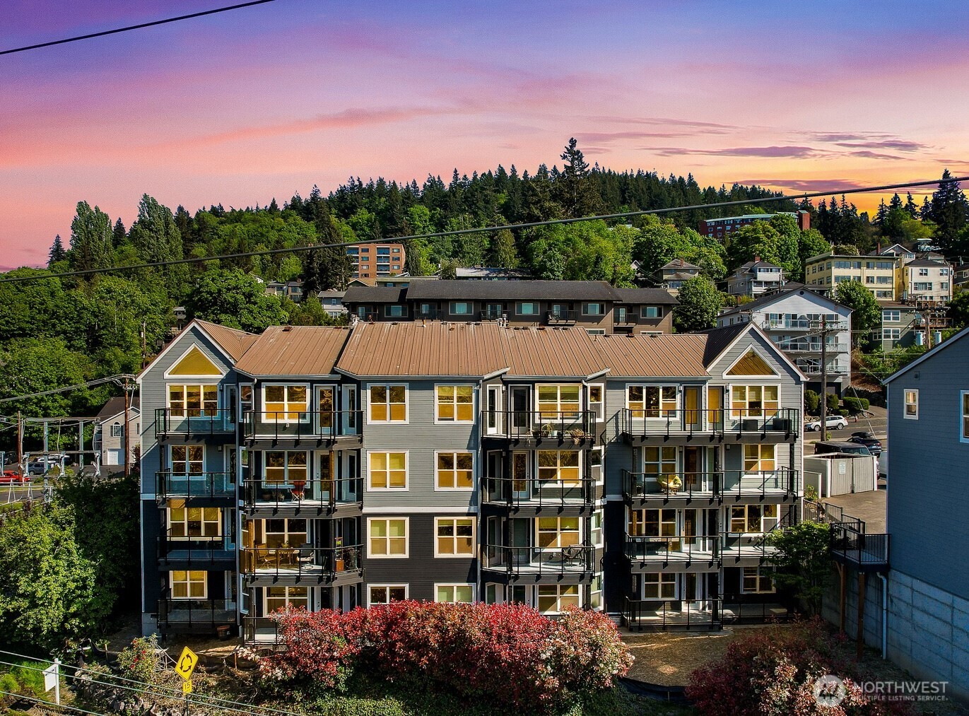 705 North State Street, Unit 202 Bellingham, WA 98225 - Photo 2 of 26 a front view of a residential apartment building with a yard