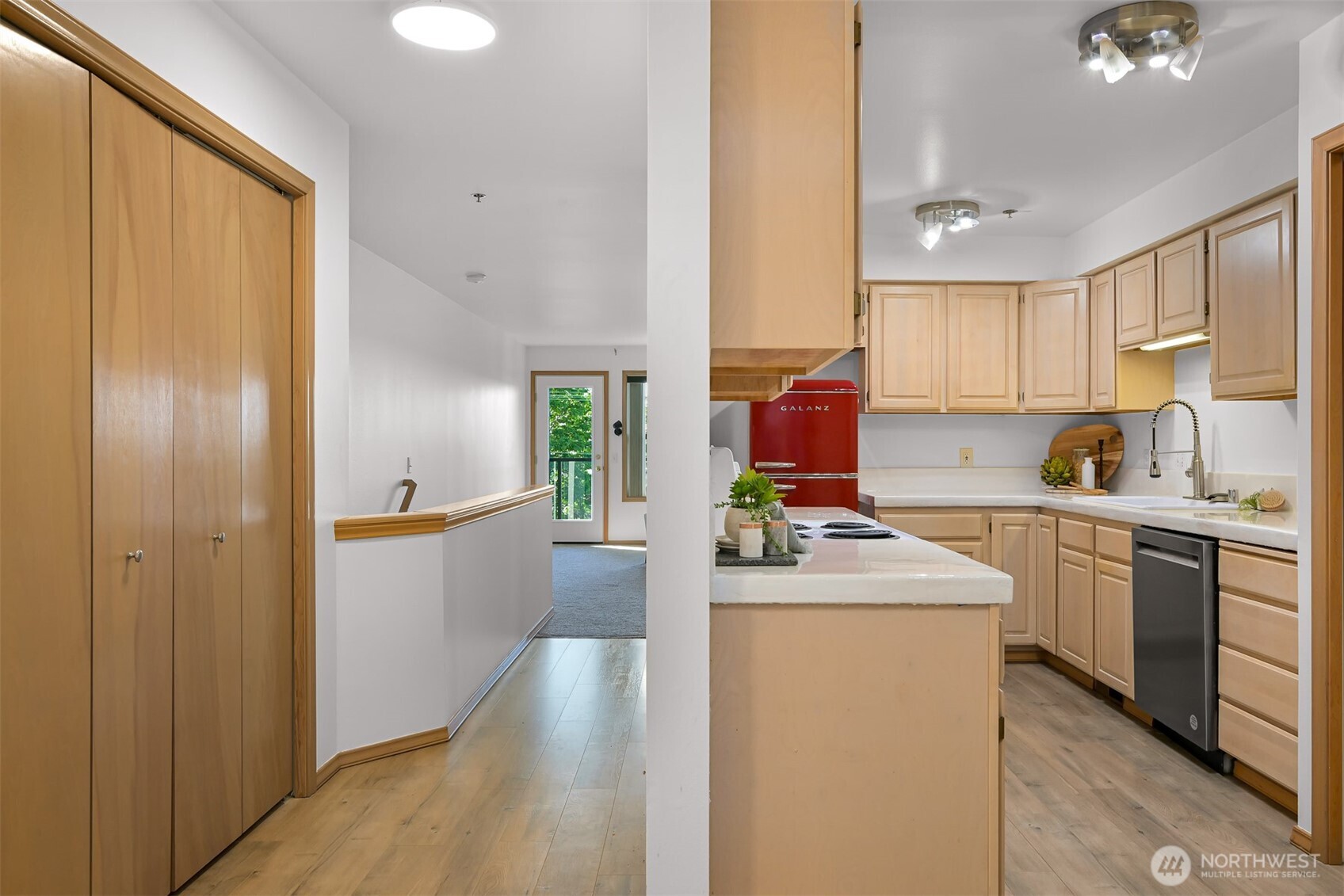 705 North State Street, Unit 202 Bellingham, WA 98225 - Photo 10 of 26 a kitchen that has a lot of cabinets in it and wooden floors