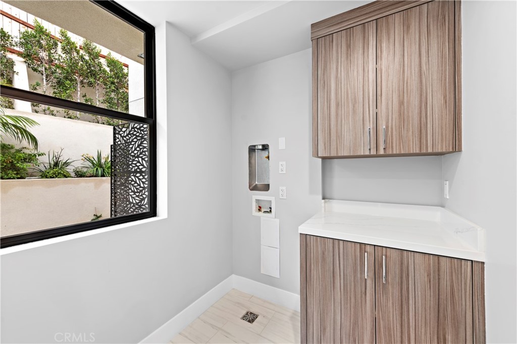 33903 Robles Drive Dana Point, CA 92629 - Photo 20 of 58 a bathroom with a bathtub and a window