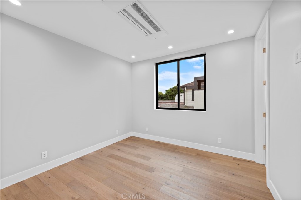 33903 Robles Drive Dana Point, CA 92629 - Photo 31 of 58 a view of empty room with wooden floor and fan