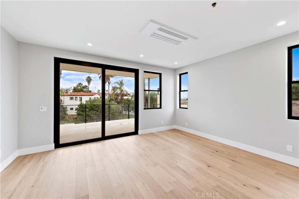 33903 Robles Drive Dana Point, CA 92629 - Photo 33 of 58 a view of an empty room with wooden floor and a window