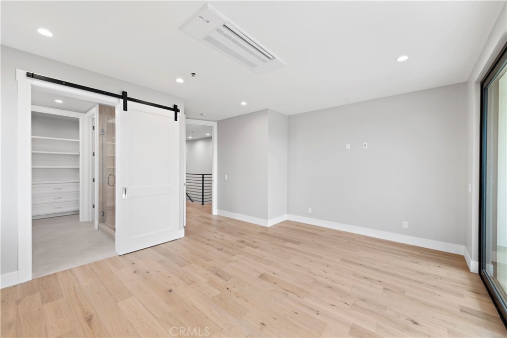33903 Robles Drive Dana Point, CA 92629 - Photo 35 of 58 a view of an empty room with wooden floor and a window
