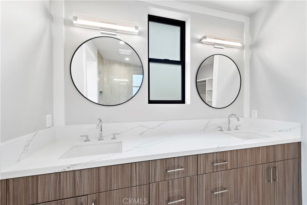 33903 Robles Drive Dana Point, CA 92629 - Photo 37 of 58 a bathroom with a sink and a mirror