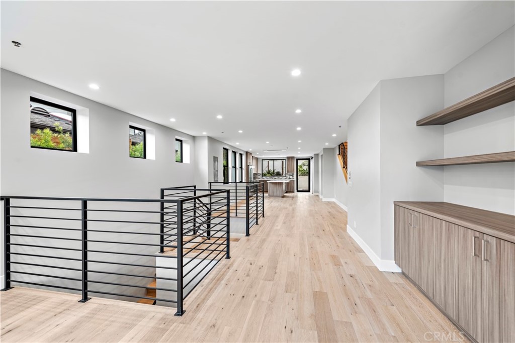 33903 Robles Drive Dana Point, CA 92629 - Photo 5 of 58 a view of a hallway with wooden floor and stairs