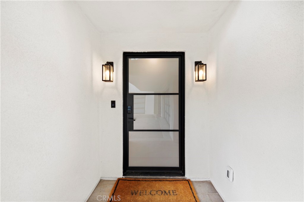 33903 Robles Drive Dana Point, CA 92629 - Photo 52 of 58 a view of front door with wooden floor