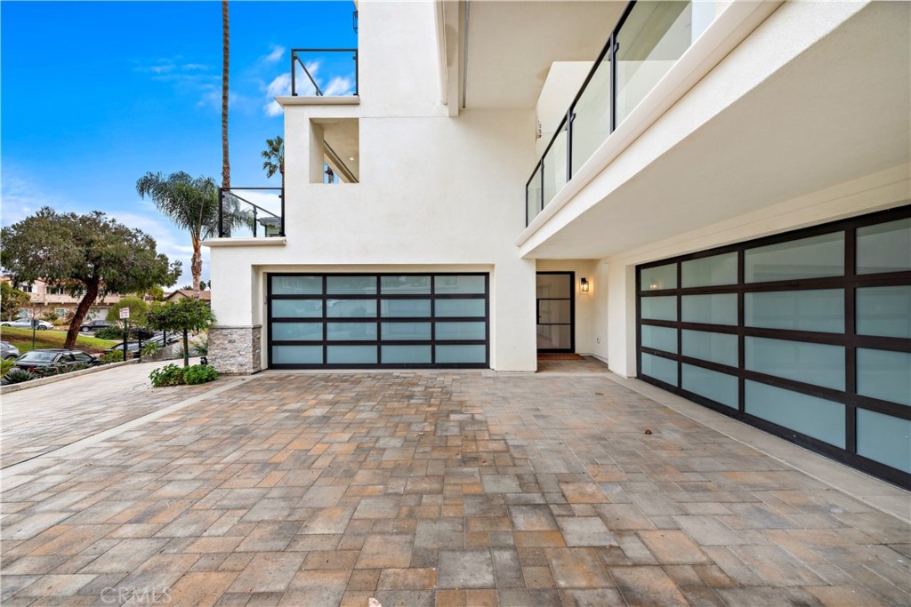 33903 Robles Drive Dana Point, CA 92629 - Photo 57 of 58 a view of front door with garage and parking space