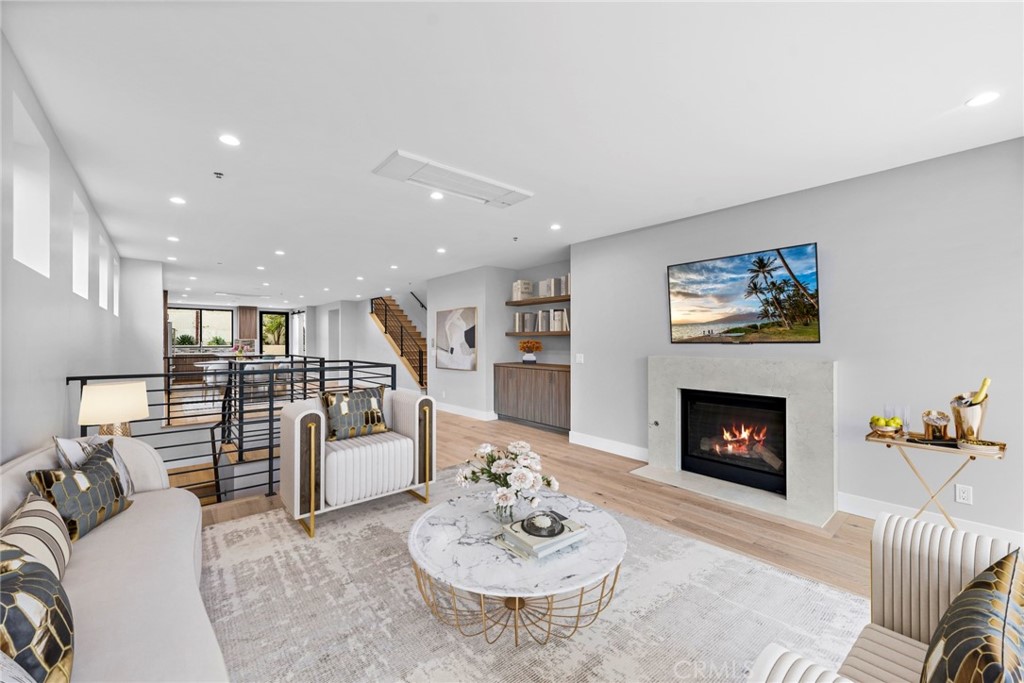33903 Robles Drive Dana Point, CA 92629 - Photo 7 of 58 a living room with furniture and a fireplace