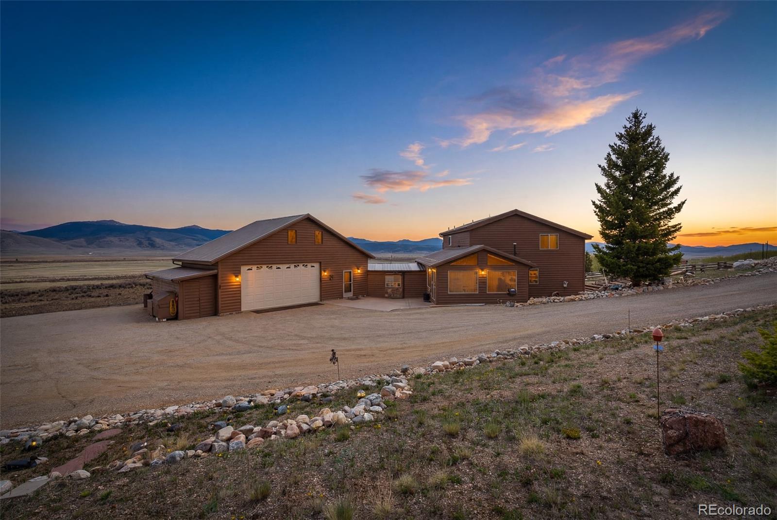 1163 Michigan Hill Road Jefferson, CO 80456 - Photo 37 of 48 a front view of a house with a yard