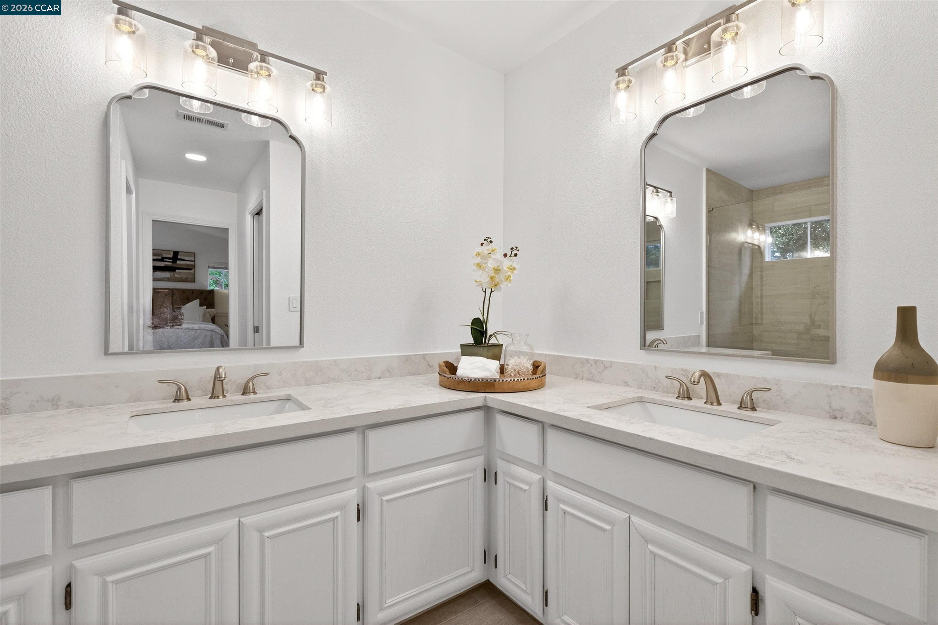 124 Coralflower Lane San Ramon, CA 94582 - Photo 19 of 47 a bathroom with double sink and a mirror