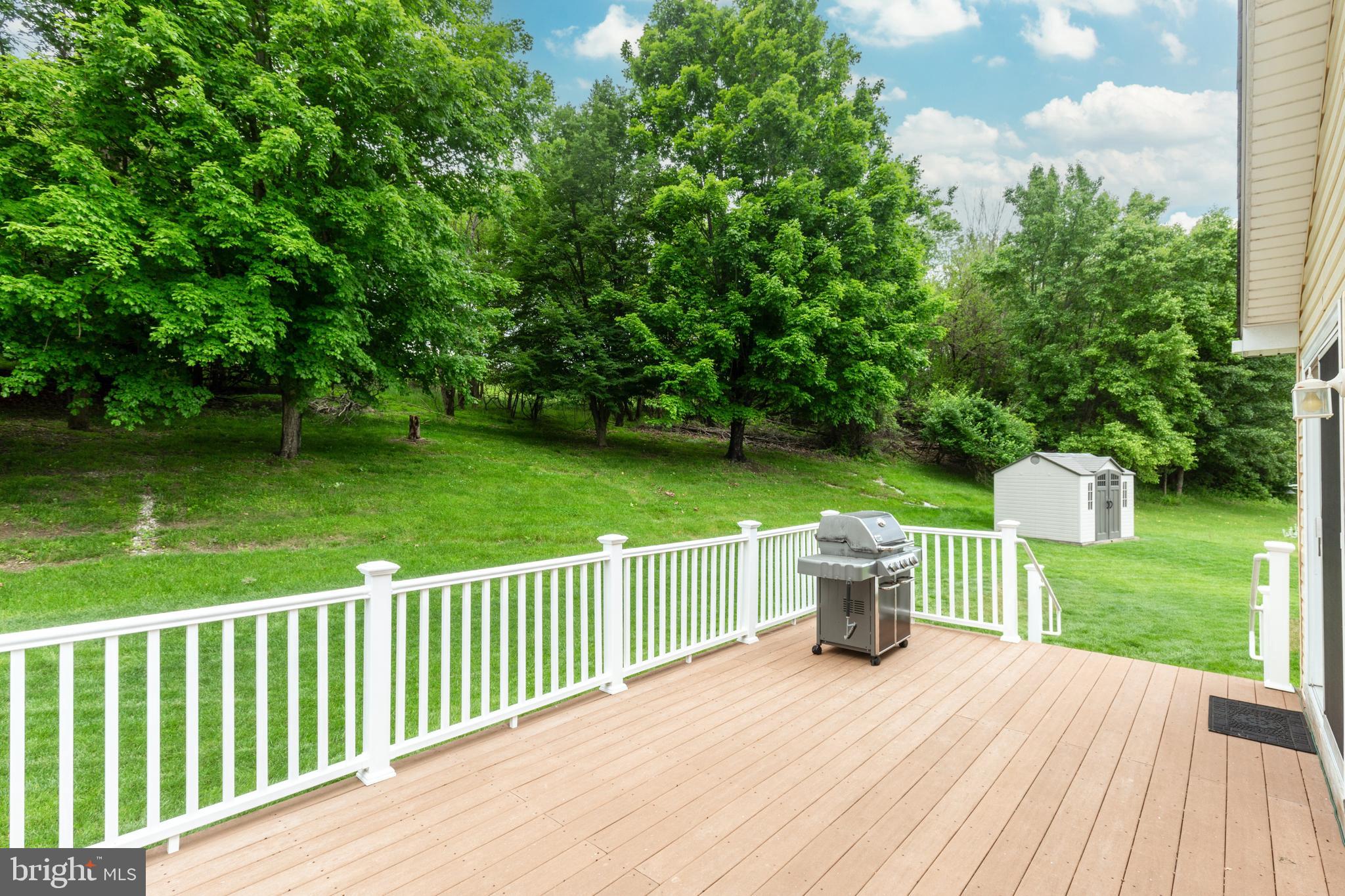 312 Inverness Close Westminster, MD 21158 - Photo 14 of 36 a view of a deck with a yard and wooden fence