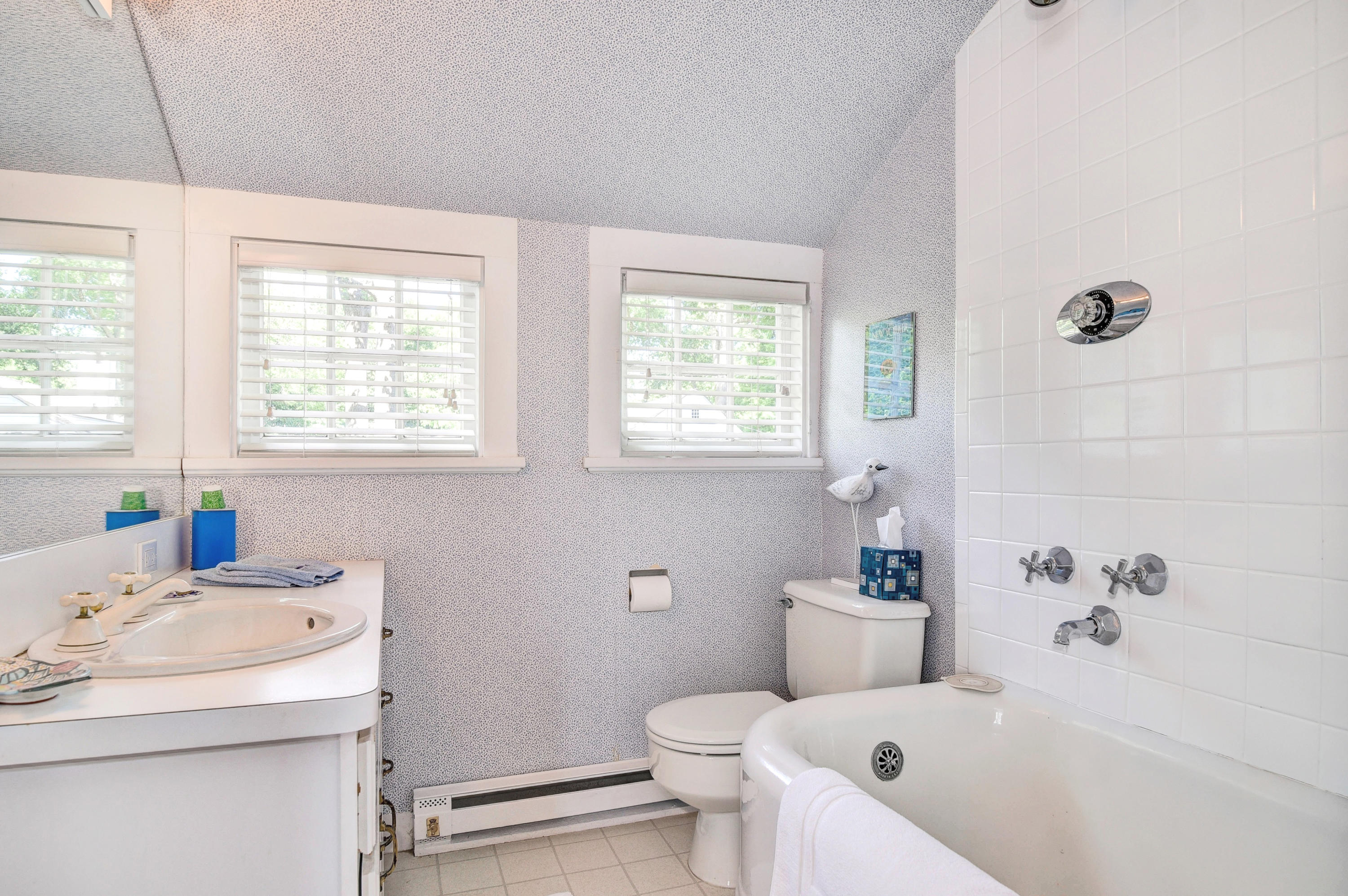 15 Sylvan Road Darien, CT 06820 - Photo 11 of 18 a bathroom with a sink a toilet and tub