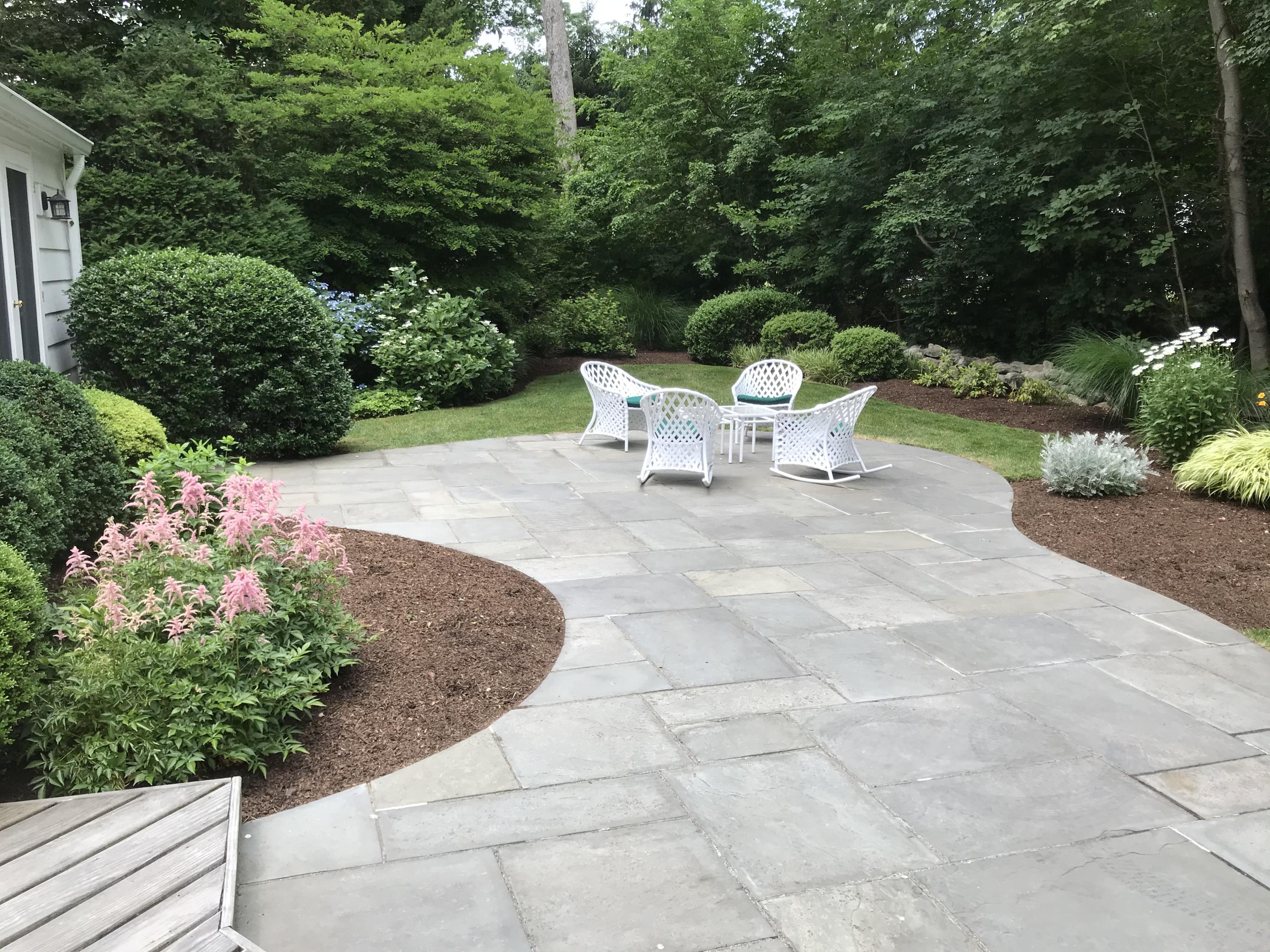 15 Sylvan Road Darien, CT 06820 - Photo 16 of 18 a view of a chairs and tables in the backyard
