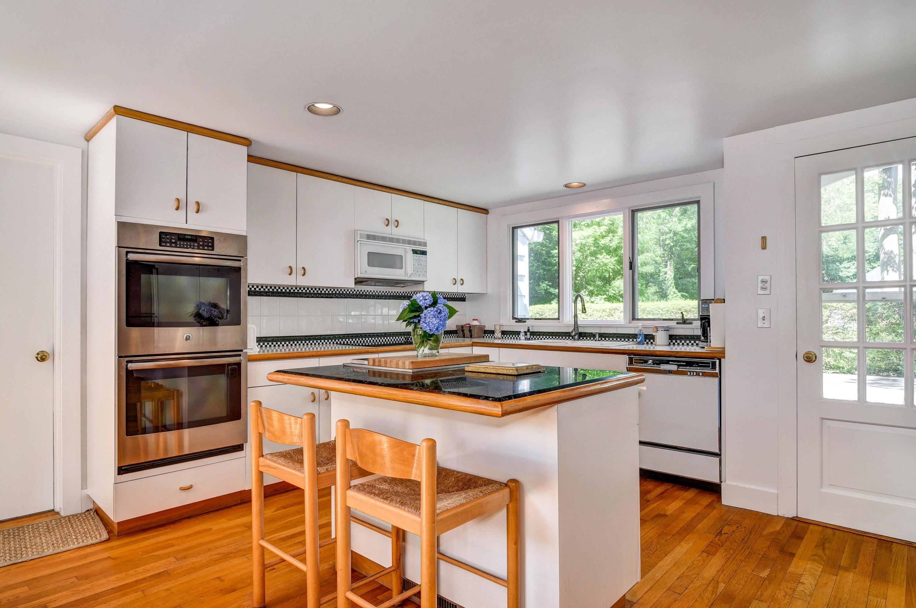 15 Sylvan Road Darien, CT 06820 - Photo 7 of 18 a kitchen with stainless steel appliances granite countertop a sink and a stove