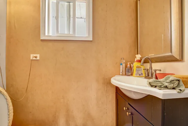 a bathroom with a sink and a mirror