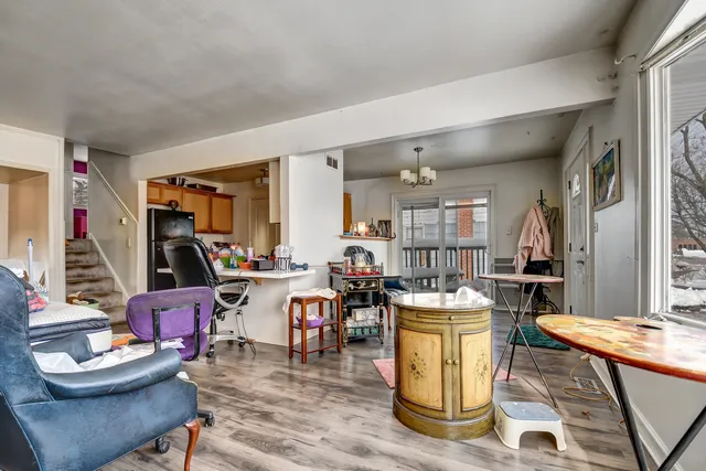 a living room with fireplace furniture and a wooden floor