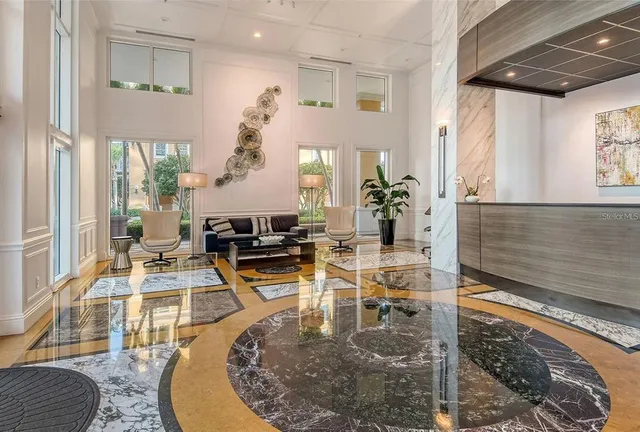 a view of a living room and kitchen