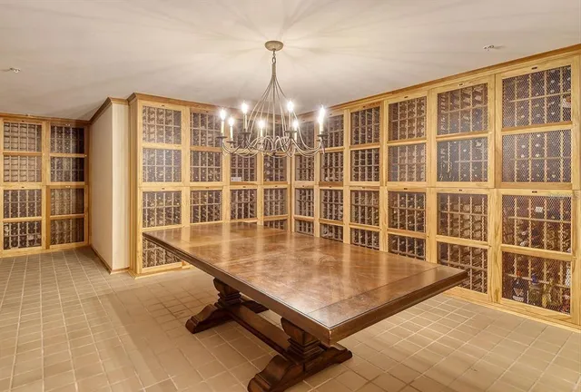 a room with pool table and windows