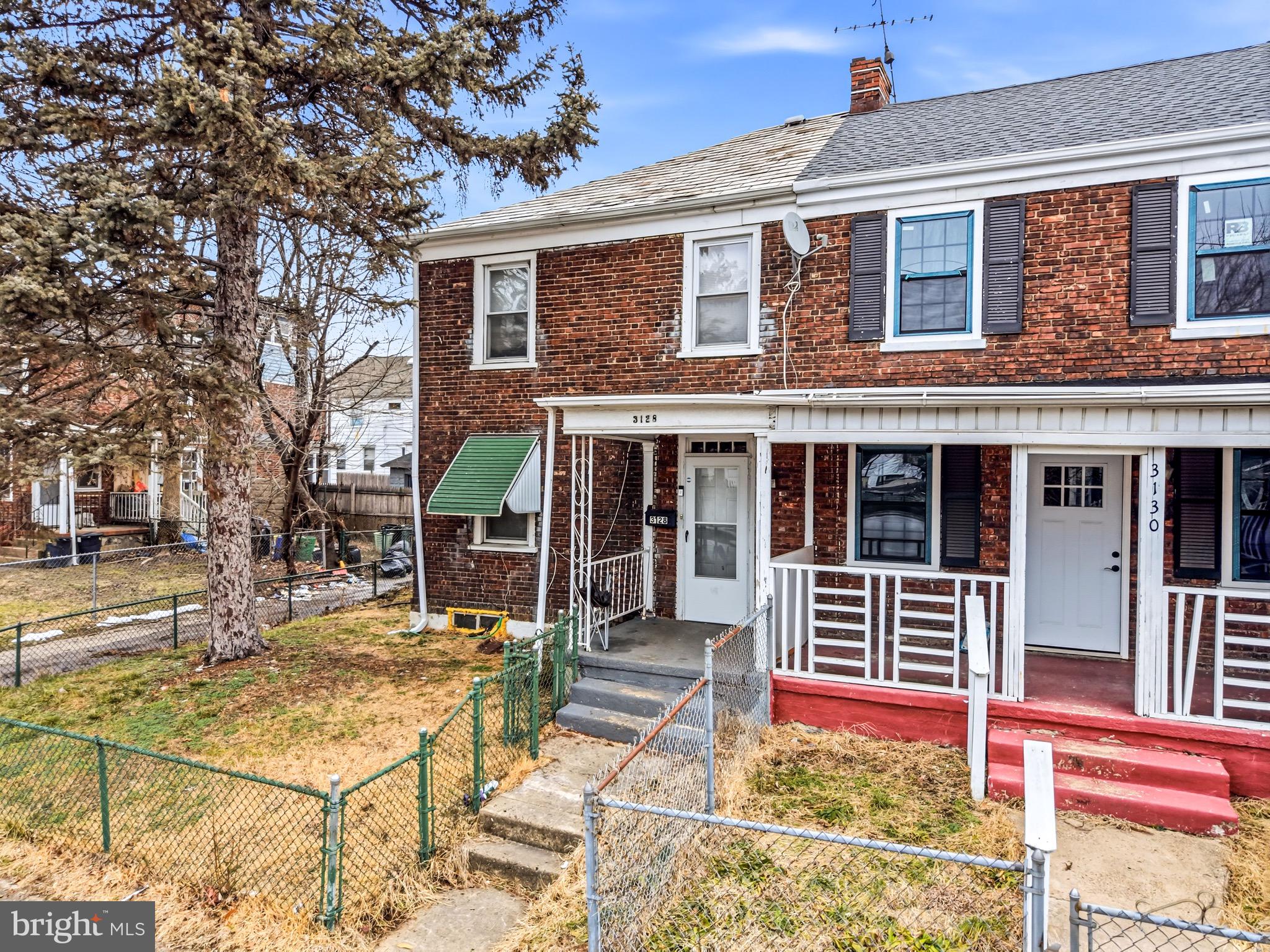 front view of a house with a yard