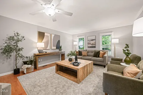 a living room with furniture and a table