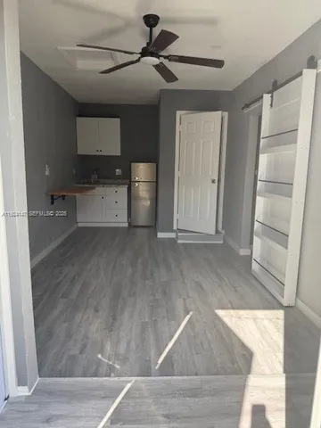 a view of a living room with a flat screen tv