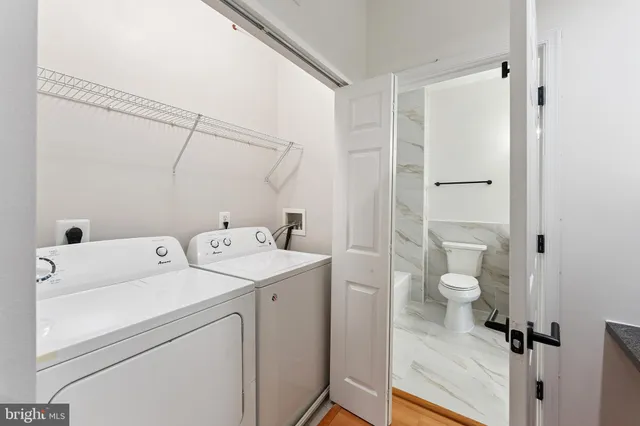 a view of bathroom with a washer and dryer