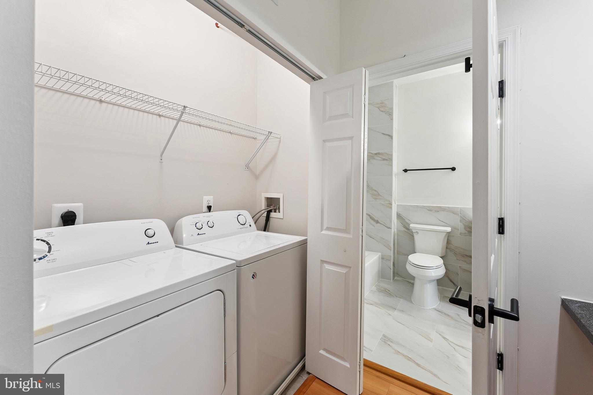 11760 Sunrise Valley Drive, Unit 809 Reston, VA 20191 - Photo 11 of 13 a view of bathroom with a washer and dryer