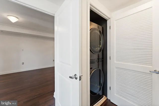 a view of a hallway with washer and dryer