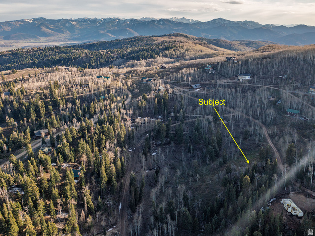 2211 Pine Loop Road, Unit 64 Coalville, UT 84017 - Photo 18 of 20 Aerial overview of property's location with a mountainous background and a heavily wooded area