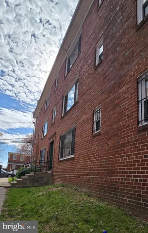 a brick building with a yard