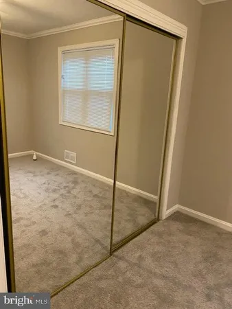 a bathroom with a granite countertop toilet and a shower