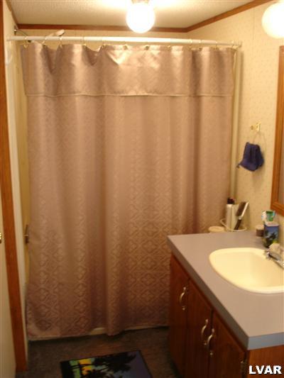 3066 Audrey Drive Coplay, PA 18037 - Photo 7 of 7 a bathroom with a shower and a sink curtain