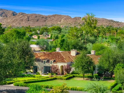 a view of house with a yard