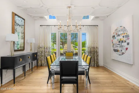 a work room with furniture bookshelf and a flat screen tv