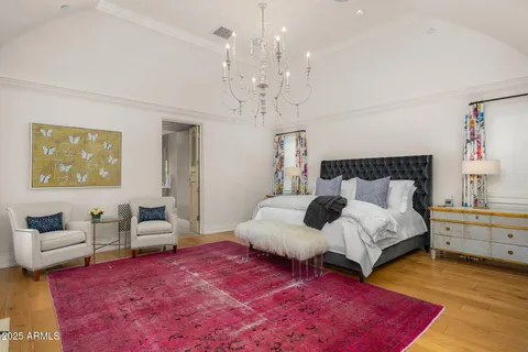 a bathroom with a tub a sink and mirror