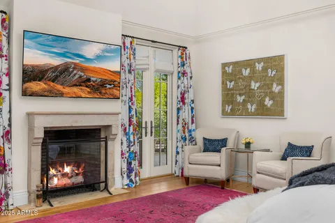 a bathroom with a sink a toilet and shower curtain