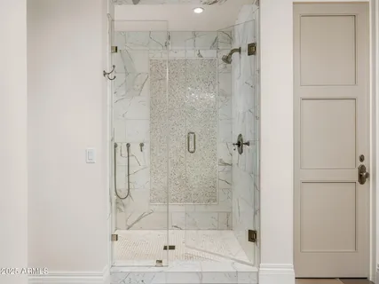 a bathroom with a granite countertop sink a toilet and mirror