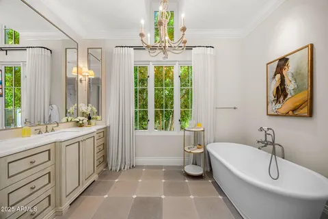 a bathroom with a granite countertop sink and a toilet