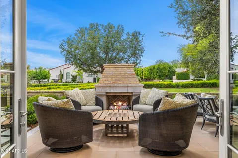 a view of swimming pool with outdoor seating and plants