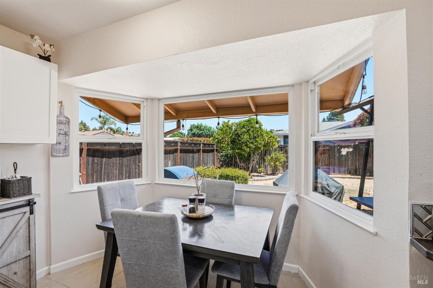 773 Blue Ridge Lane Vacaville, CA 95688 - Photo 22 of 44 a view of a dining room with furniture large windows and wooden floor