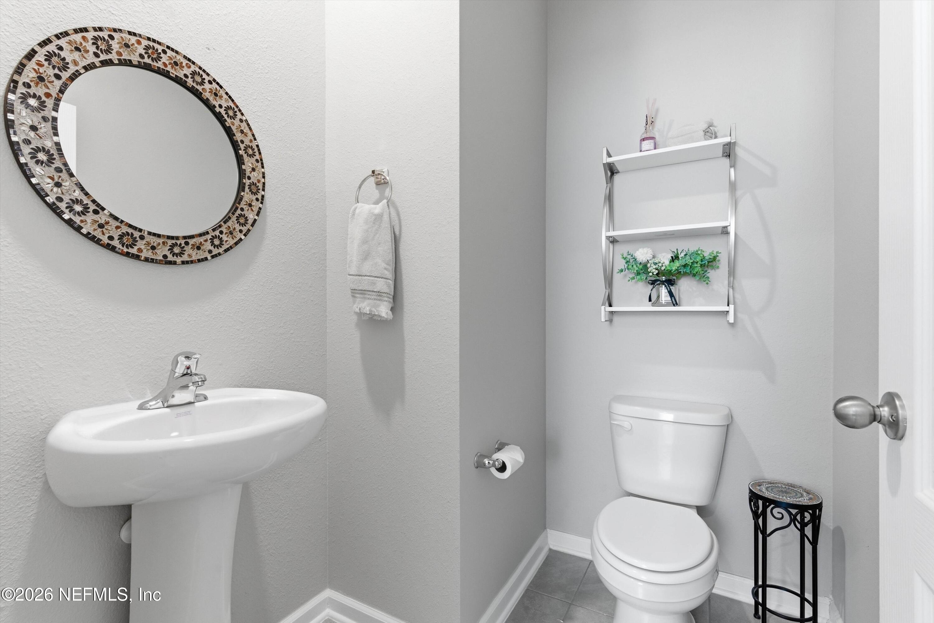 103 Seaport Breeze Road St. Augustine, FL 32095 - Photo 16 of 44 a bathroom with a sink and a toilet